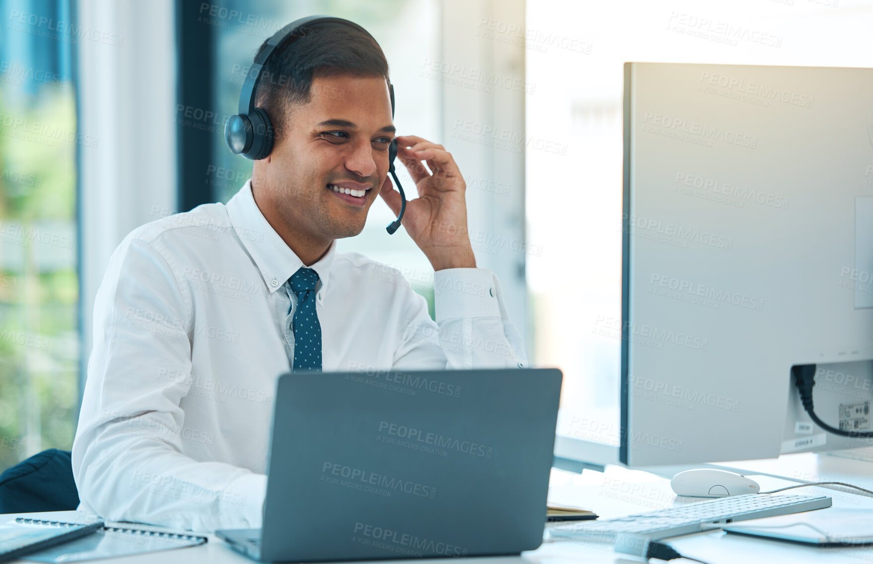 Buy stock photo Call center, computer and man in customer service, happy and help desk support in office. Laptop, telemarketing and sales agent in communication, consulting or listening to contact us in crm business