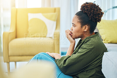 Buy stock photo Home, anxiety and woman with fear, depression and scared with mental health, biting nails and mistake in a lounge. Person on the floor, lady or girl confused, fail and waiting for feedback or results