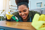 Smile, woman and cleaning table with gloves, spray bottle and soap detergent, housekeeping in home or hotel. Housework, smudge and housekeeper or cleaner service washing dirt off counter in apartment