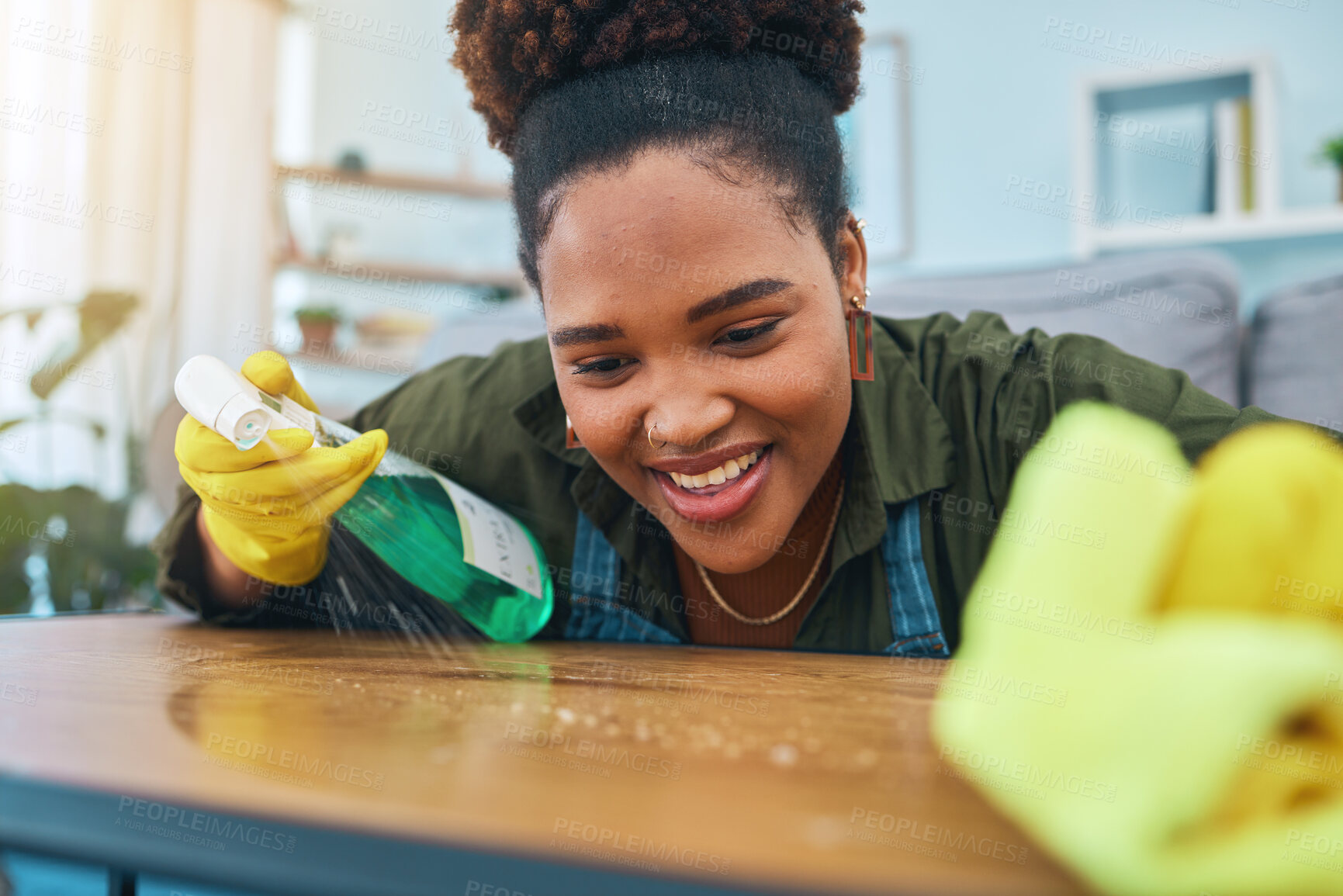 Buy stock photo Smile, woman and cleaning table with gloves, spray bottle and soap detergent, housekeeping in home or hotel. Housework, smudge and housekeeper or cleaner service washing dirt off counter in apartment