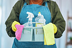 Cleaning, basket with chemical detergent and cloth, cleaner person with housekeeping or hospitality. Janitor, maintenance and labor, supplies and fabric with service, disinfectant and hygiene