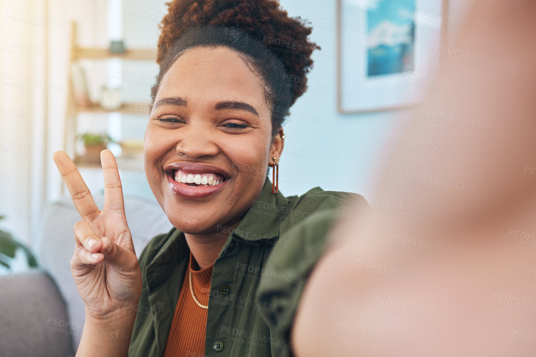 Buy stock photo Woman, portrait and peace for selfie in home, smile and post live streaming vlog in living room. Face of happy african gen z, profile picture or show v sign with hand emoji for social media broadcast