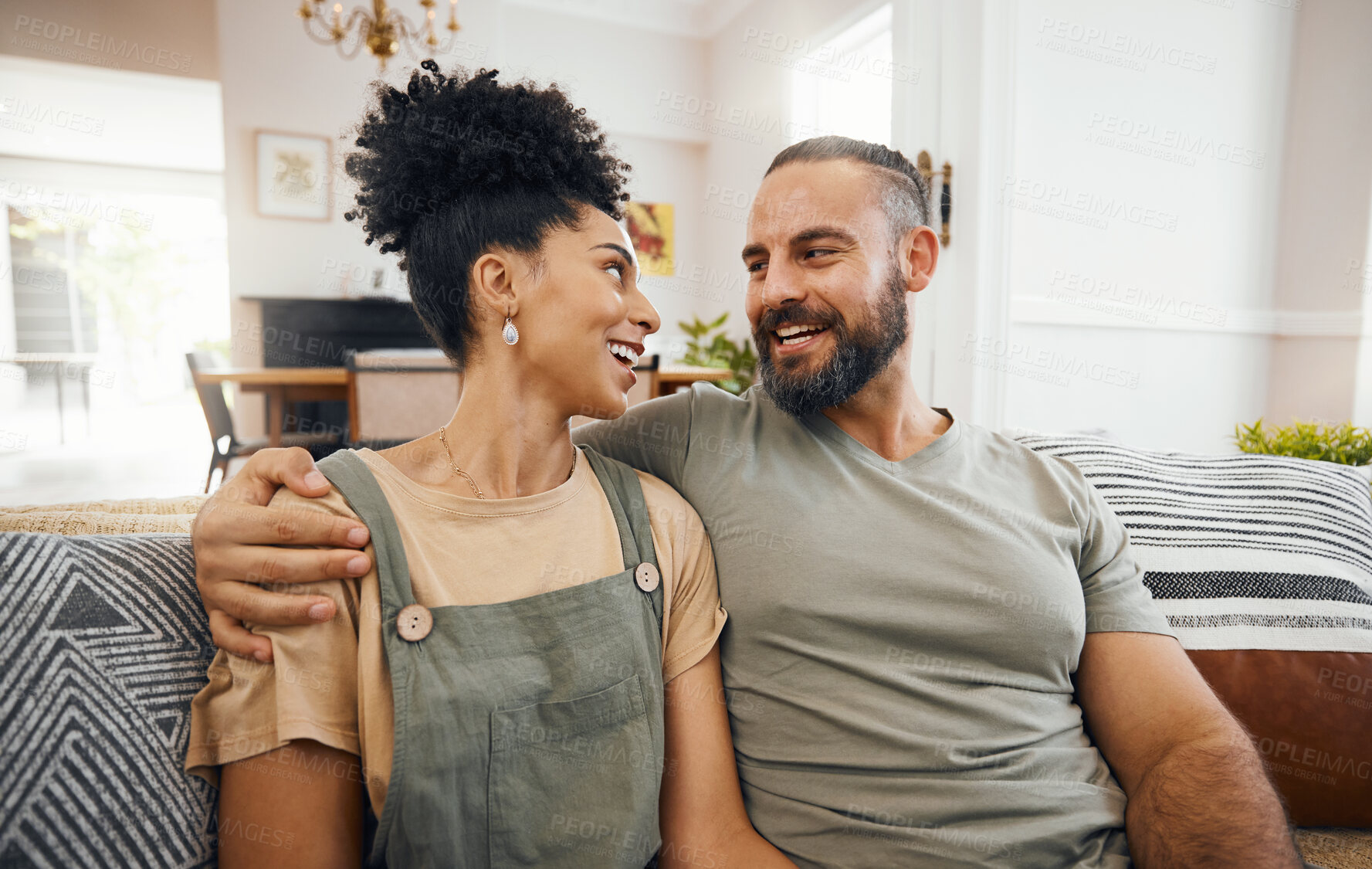 Buy stock photo Home, love and couple on a couch, smile or support with happiness, conversation or relax in a lounge. People, man or woman on a sofa, marriage or romance with relationship, bonding or loving together