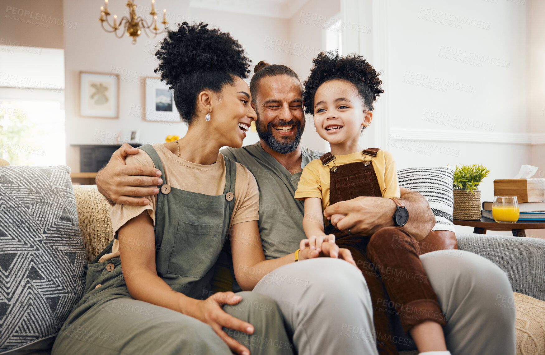 Buy stock photo Smile, relax and an interracial family on the sofa for conversation, love and bonding. Happy, house and a mother, father and a boy child on the couch for talking, care and together for communication