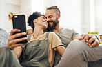 Interracial couple, selfie and smile on couch, holding hands or laugh with memory, web blog or post on internet. Man, woman and happy for photography, profile picture or love on sofa for social media