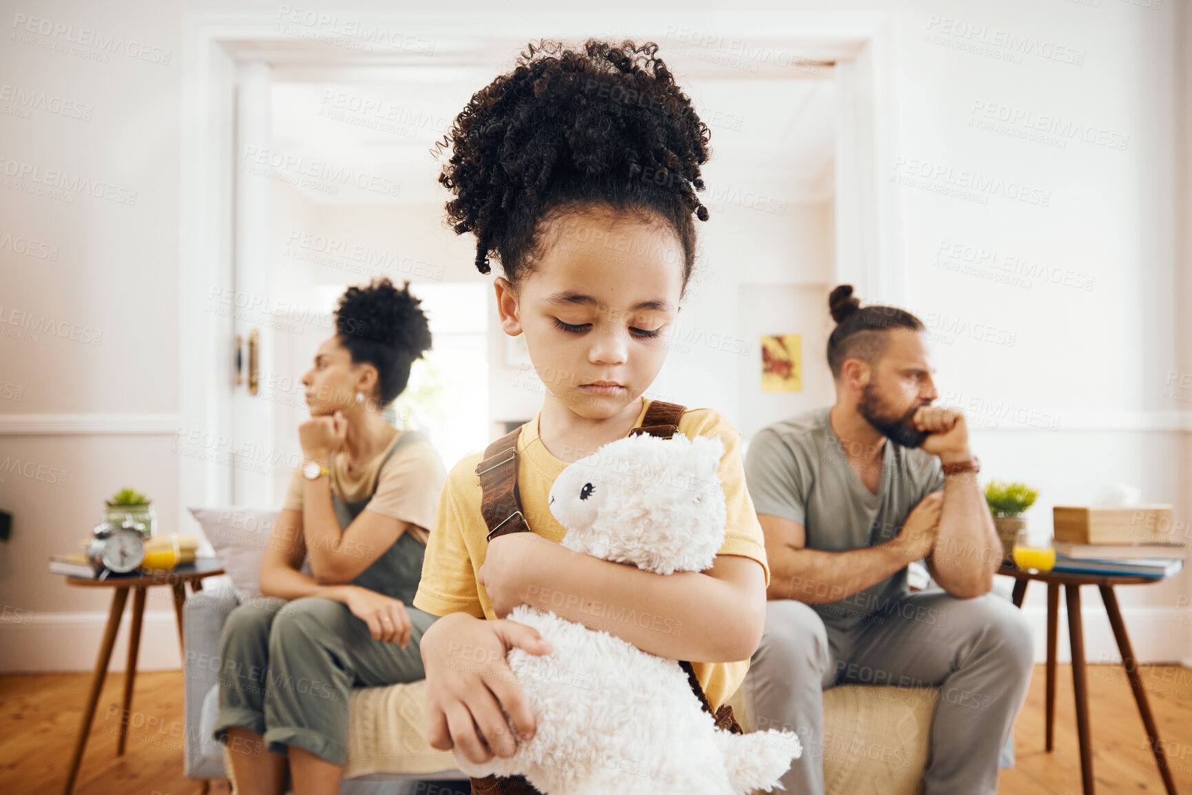 Buy stock photo Divorce, fight and sad boy child with teddy bear in a living room for stress, support and comfort at home. Family, crisis and kid with anxiety for toxic parents, argue or dispute, depression or fear