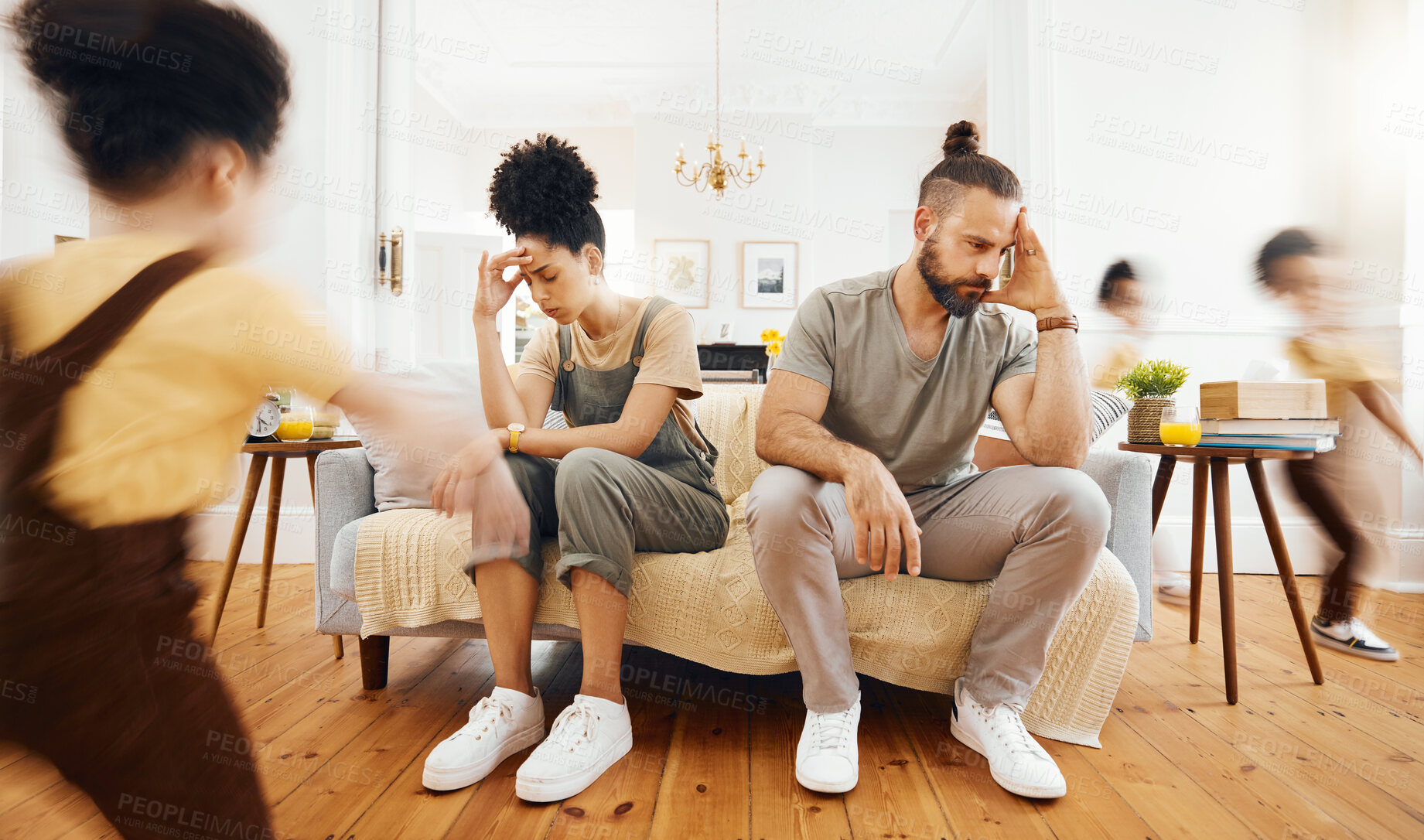 Buy stock photo Family, kid and tired parents on sofa with headache, stress or divorce fight for running child with energy. Chaos, burnout and children in living room with mother, father or frustrated anxiety crisis