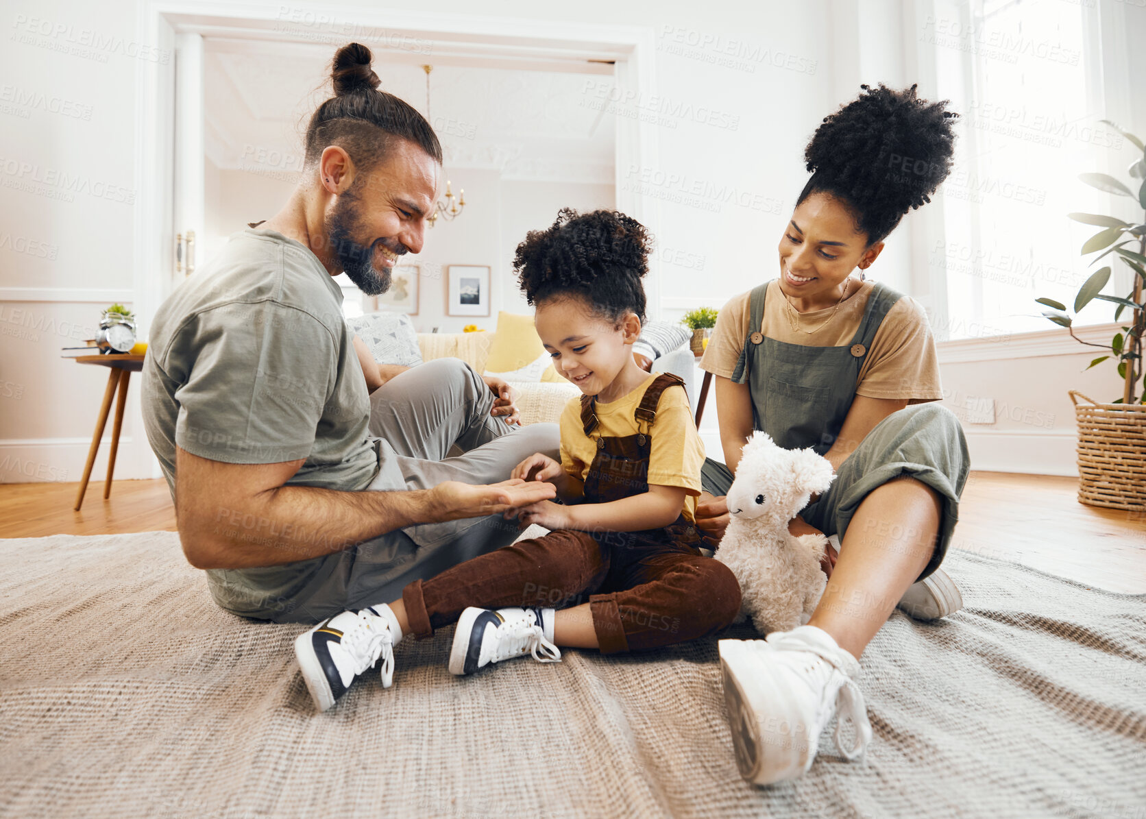 Buy stock photo Happy family, bond and relax on a floor with care, fun and hand game in a home. Love, carpet and boy child with interracial parents in living room playing, learning and development together in house