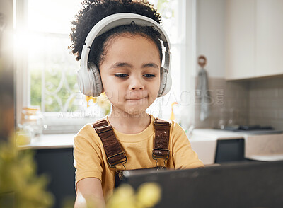 Buy stock photo Tablet, headphones and kid in online education in home, elearning or homeschool in kitchen. Serious, technology and boy child on video call, study on internet and listening to music in virtual class