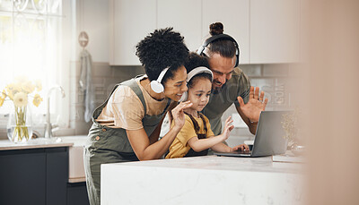 Buy stock photo Interracial parents, kid and video call with laptop, headphones and wave hello with smile in kitchen. Mother, father and child with computer, happy and contact with webinar with chat in family home