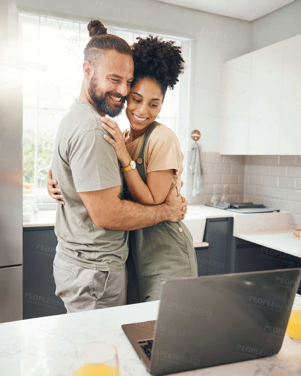 Buy stock photo Couple, laptop and hug in home kitchen for influencer post, social media or streaming connection. Interracial man and woman love, care or support for network, internet or communication on technology