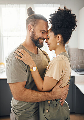 Buy stock photo Interracial couple, hug and forehead touch in kitchen, love and bonding with happiness while at home. Trust, support and commitment, affection and embrace with people in a healthy relationship