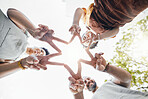 Family, hands together and star fingers outdoor in low angle, happy and bonding. Father, mother and child huddle in love, solidarity and interracial support in cooperation, connection and success