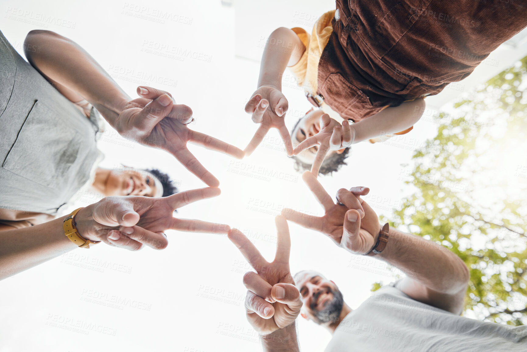 Buy stock photo Family, hands together and star fingers outdoor in low angle, happy and bonding. Father, mother and child huddle in love, solidarity and interracial support in cooperation, connection and success