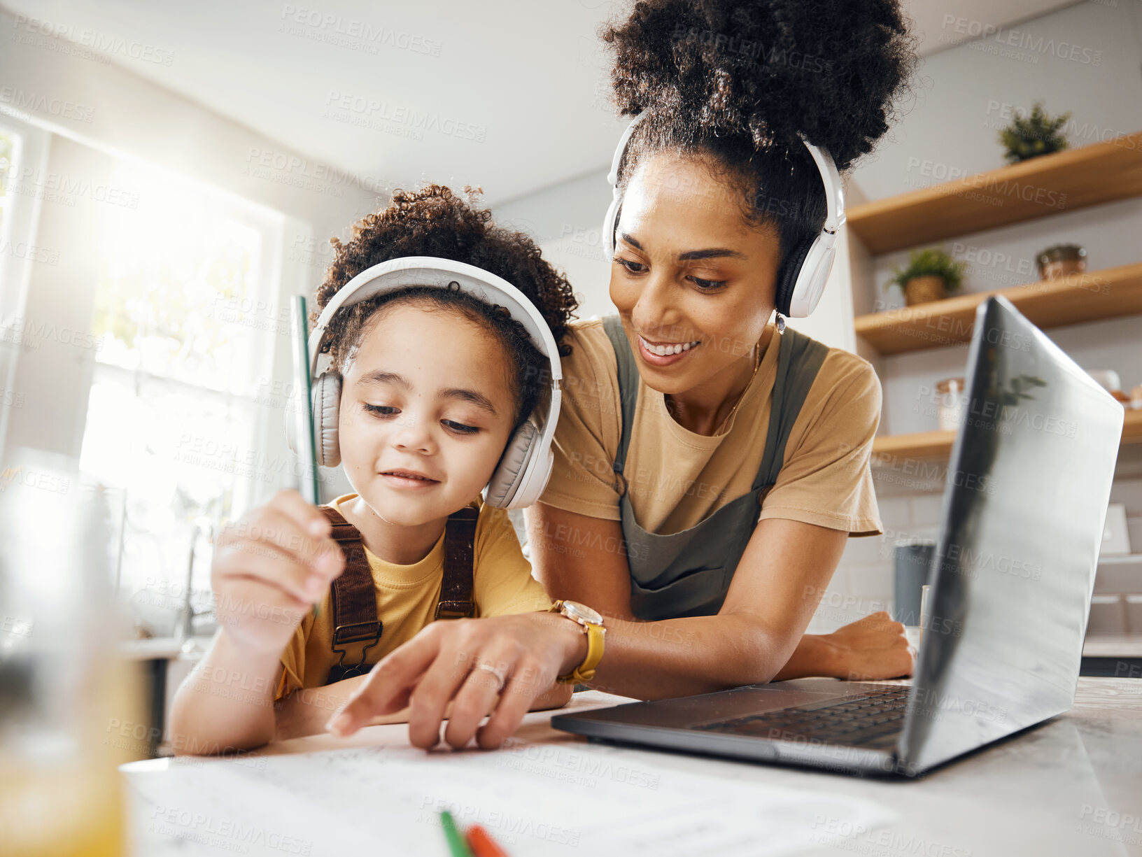 Buy stock photo Elearning, mom and child in home with headphones, laptop and homework for online class. Computer, mother and boy working together for virtual school, help with writing and kids education in kitchen.