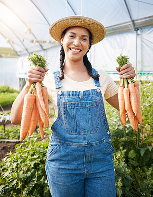Buy stock photo Farming, portrait of woman with carrots and smile at sustainable small business, agriculture and natural food. Girl working at happy agro greenhouse, vegetable growth in garden and eco friendly pride