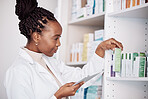 Pharmacy, woman and digital tablet on medicine shelf, healthcare inventory and boxes or stock management. Medical pharmacist or african doctor for pills search, drugs package or e commerce technology