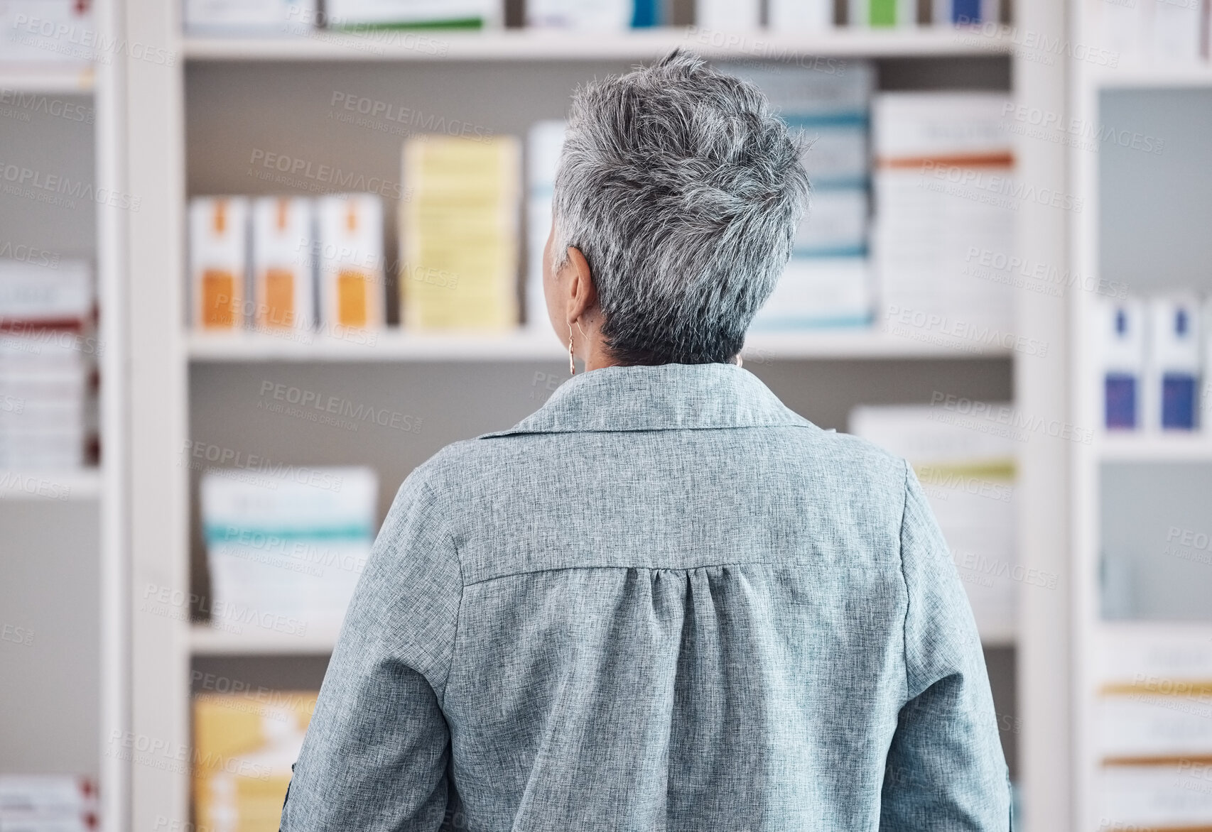 Buy stock photo Patient, pharmacy and checking pharmaceutical shelf for medication, healthcare or boxes at the drugstore. Rear view of customer in search for medical product, supplements or antibiotics at the clinic