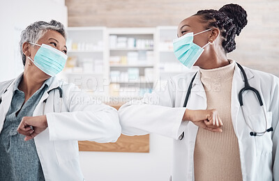 Buy stock photo People, doctor and face mask in elbow greeting, meeting or handshake in social distancing at hospital. Women, medical or healthcare team touching arms in regulations, pandemic or health and safety