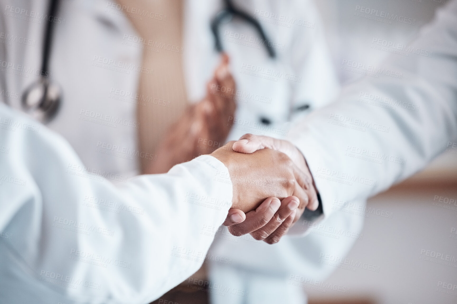 Buy stock photo Closeup, teamwork or doctors shaking hands for goal, good job or promotion success in a hospital meeting. Clapping, congratulations or proud healthcare worker with handshake for medical collaboration