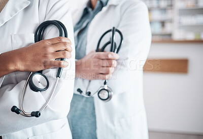 Buy stock photo People, doctor and hands of professional with stethoscope in healthcare, pharmaceutical or help at pharmacy. Closeup of medical experts with arms crossed in confidence for health service at drugstore