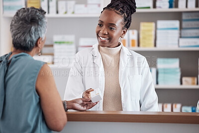 Buy stock photo Pharmacist, pharmacy and customer for medicine service, healthcare advice and clinic solution or support by counter. African doctor, women or medical people with box of pills, product or retail drugs