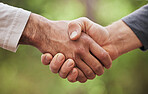 Support, thank you and handshake with people in nature for motivation, welcome and meeting. Teamwork, trust and collaboration with closeup of friends shaking hands in park for partnership and hello