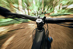 POV, mountain bike and person cycling in nature, park and forest for adventure, speed and motion blur. Closeup, perspective and bicycle handle for outdoor action, fast power and off road performance