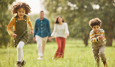 Buy stock photo Running, park and parents with children in nature for playing, bonding and fun together in field. Happy family, mother and father with kids outdoors for freedom on holiday, adventure and vacation