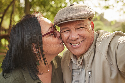 Buy stock photo Selfie, kiss and senior couple in a park happy, bond and having fun in nature together. Portrait, love and elderly man with old woman in forest smile for profile picture, kissing and enjoy retirement