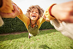 Child, spin and outdoor in pov, holding hands and happy for game with parent, holiday and backyard. Excited young kid, smile and swing in air, fast and lawn for play on vacation in summer sunshine