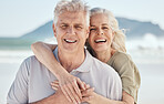 Hug, beach and portrait of senior couple on a romantic vacation, adventure or weekend trip. Happy, smile and elderly woman and man in retirement embracing with love and care by the ocean on holiday.