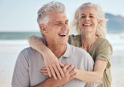 Buy stock photo Senior, happy couple and hug on beach in support, love or care for bonding, weekend or break together. Elderly man and woman smile in happiness for holiday, vacation or outdoor getaway on ocean coast