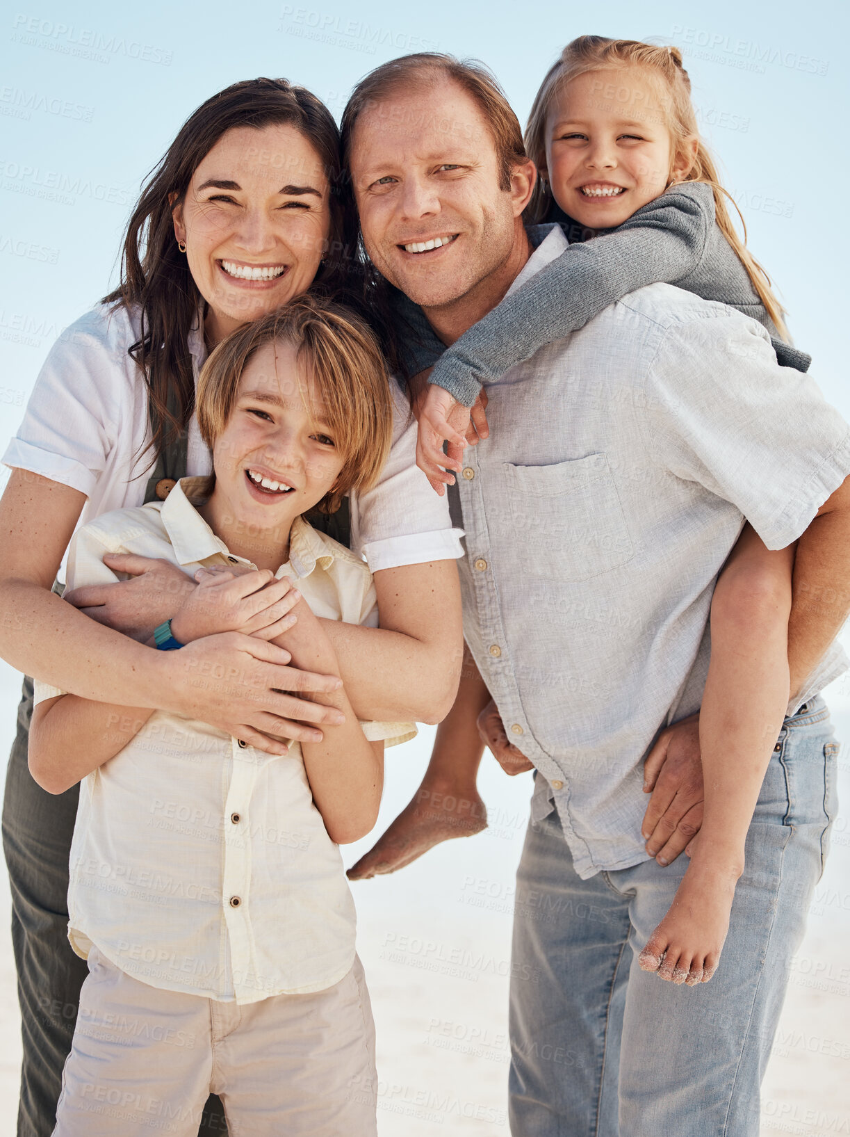 Buy stock photo Portrait, family and smile on vacation at beach, bonding and funny laugh together. Parents, children and mother with father at ocean, happy and having fun to travel on summer holiday outdoor at sea