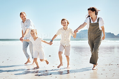Buy stock photo Happy family, holding hands and playing on beach in holiday, weekend or outdoor bonding together. Father, mother and children smile in happiness for summer vacation or fun on ocean coast in nature
