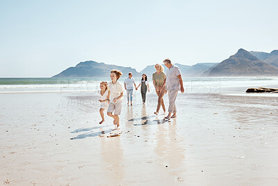 Buy stock photo Family holding hands on beach, generations and travel with grandparents, parents and kids outdoor. Happiness, adventure and sea with love and care, people on vacation with trust and support in nature
