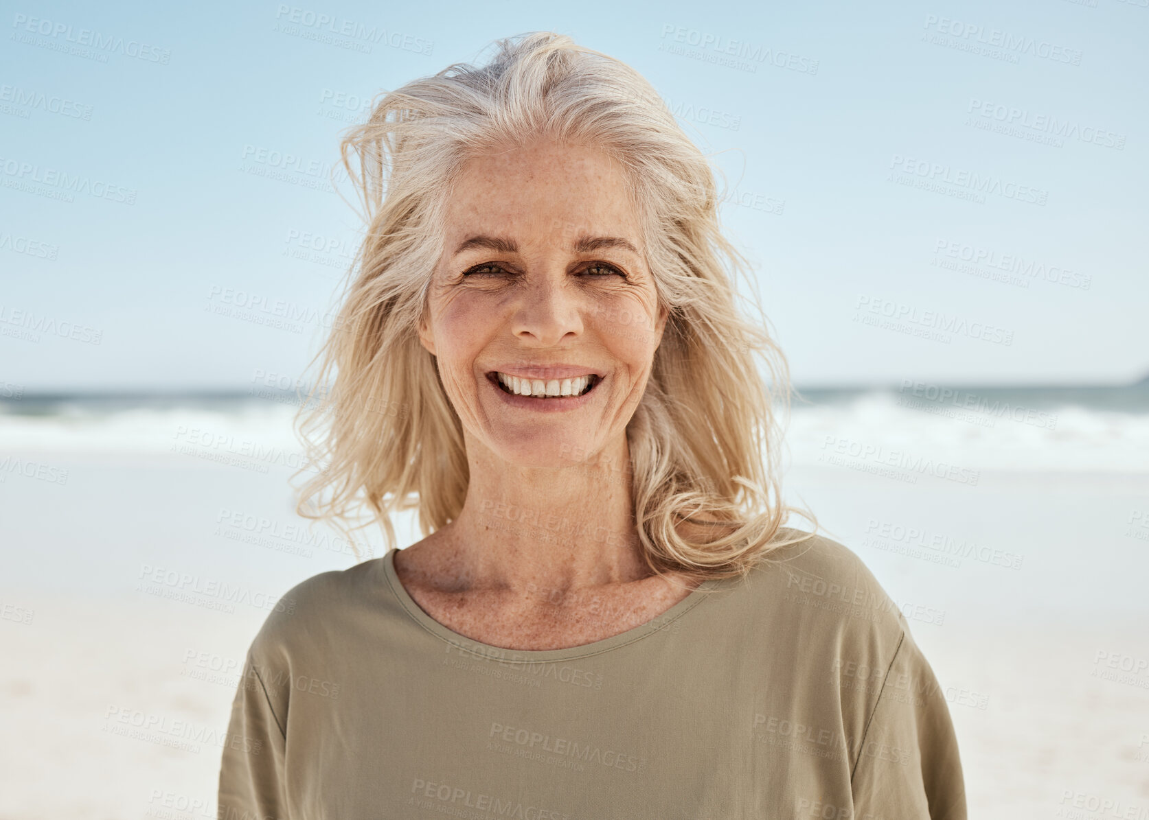 Buy stock photo Portrait, beach and senior woman with a smile, retirement and travel with tourist, summer vacation and wellness. Face, old person and traveler on seaside holiday, Canada and weekend break for peace