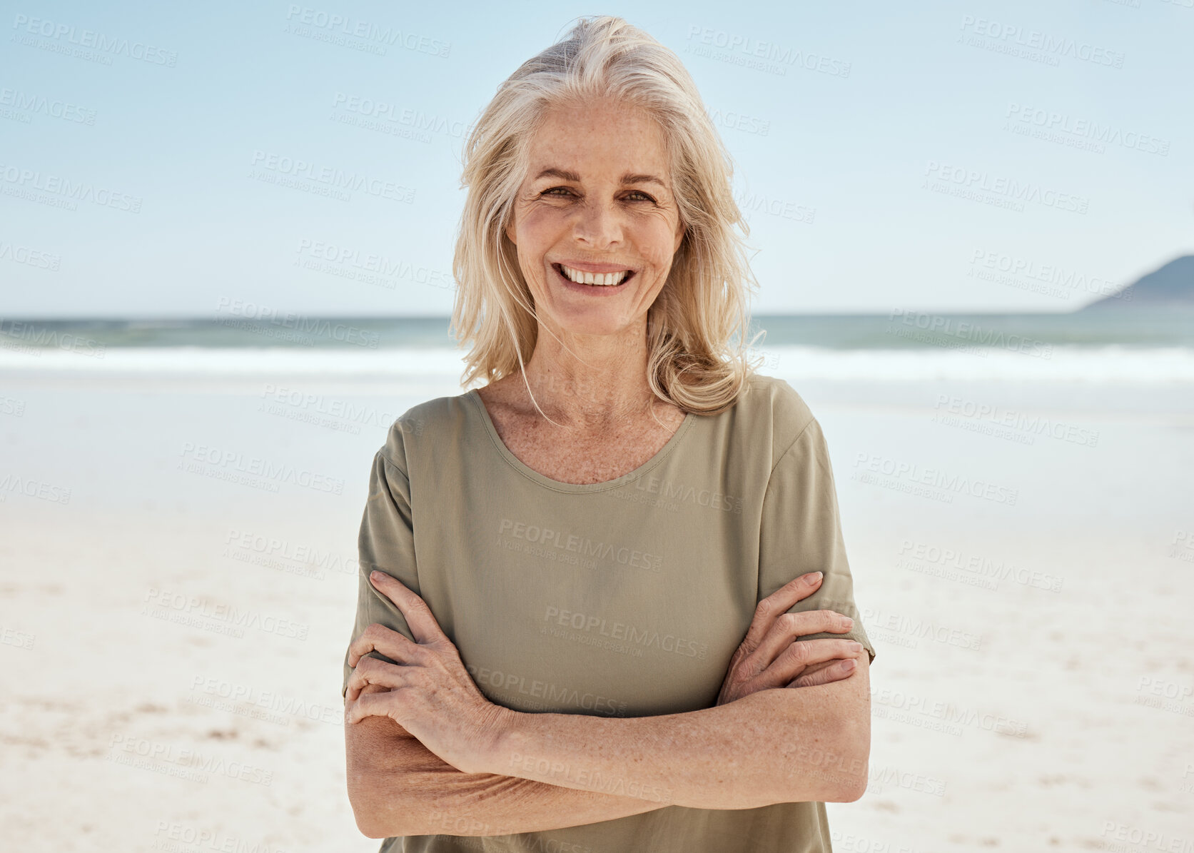 Buy stock photo Beach portrait, arms crossed and senior woman relax for outdoor wellness, nature freedom or travel holiday in Canada. Sand, ocean sea water and elderly person smile for retirement vacation happiness