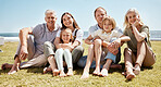 Portrait, big family and smile on vacation at beach, bonding and relax together. Grandparents, children and mother with father at ocean, happy or having fun to travel on summer holiday outdoor at sea