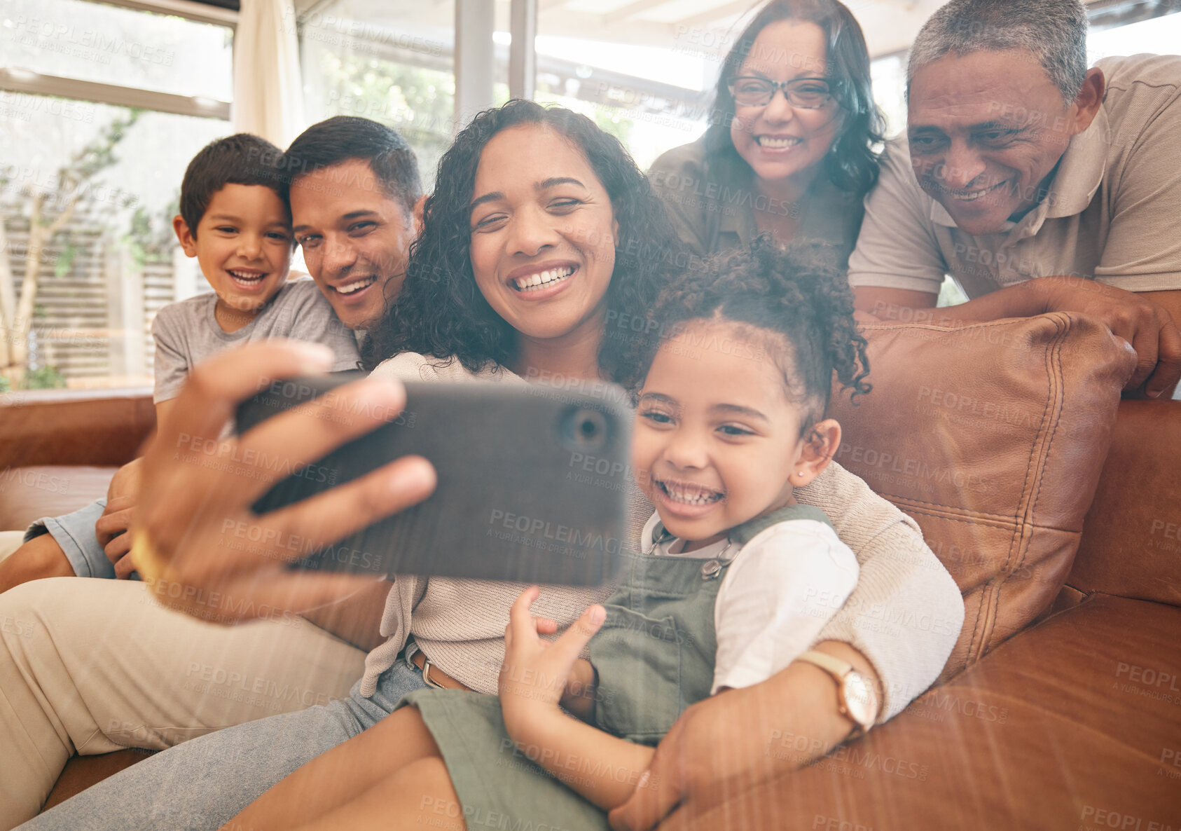 Buy stock photo Family selfie, happy grandparents and children on sofa with hug, love and relax together at home for social media. Interracial people, mom and dad with kids on couch for profile picture photography