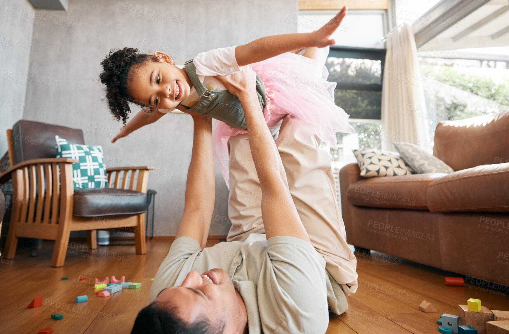 Buy stock photo Airplane, love and girl child with father on a floor for playing, games and bond at home with toys. Flying, fantasy and excited kid with parent in a living room for fun, trust and support in a house