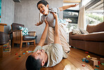 Child, father and airplane games in home on living room floor for support, happy together and crazy fun. Dad, boy and excited kid flying for freedom, fantasy and playing with balance, care and energy