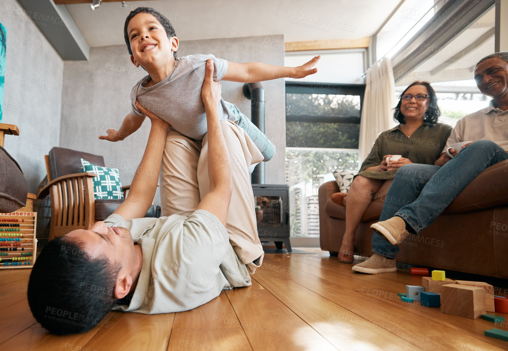 Buy stock photo Airplane, love and boy child with father on a floor for playing, games and bond at home with grandparents. Flying, fantasy and excited kid with parent in living room for fun family time in a house