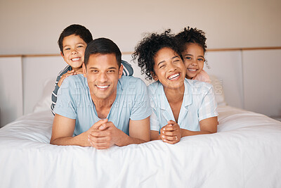 Buy stock photo Happy, portrait and relax with family in bedroom for playful, morning and love. Care, support and wake up with parents and children laughing in bed at home for weekend, positive and resting together