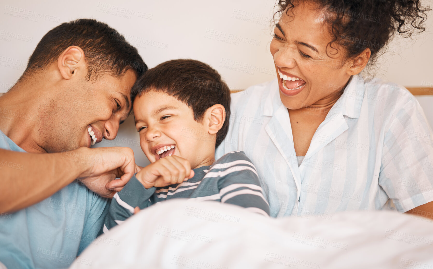Buy stock photo Happy, tickle and smile with family in bedroom for playful, morning and love. Care, support and wake up with parents and boy child laughing in bed at home for weekend, positive and relax together