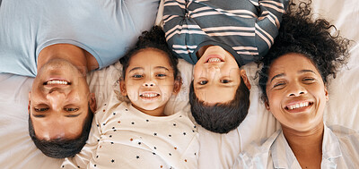 Buy stock photo Happy, smile and portrait with family in bedroom for playful, morning and love. Care, support and wake up with parents and children from above in bed at home for weekend, positive or resting together
