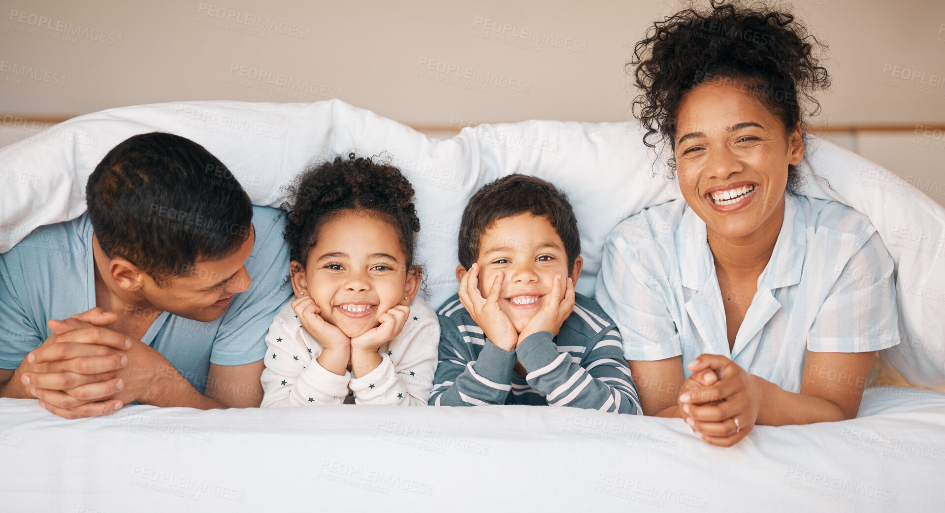 Buy stock photo Smile, love and portrait with family in bedroom for playful, morning and happy. Care, support and wake up with parents and face of children laughing in bed at home for weekend and relax together