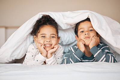 Buy stock photo Siblings, morning and portrait of children in bed in blanket for bonding, love and fun at home. Family, childhood and face of happy young boy and girl in bedroom for relax, resting and smile together