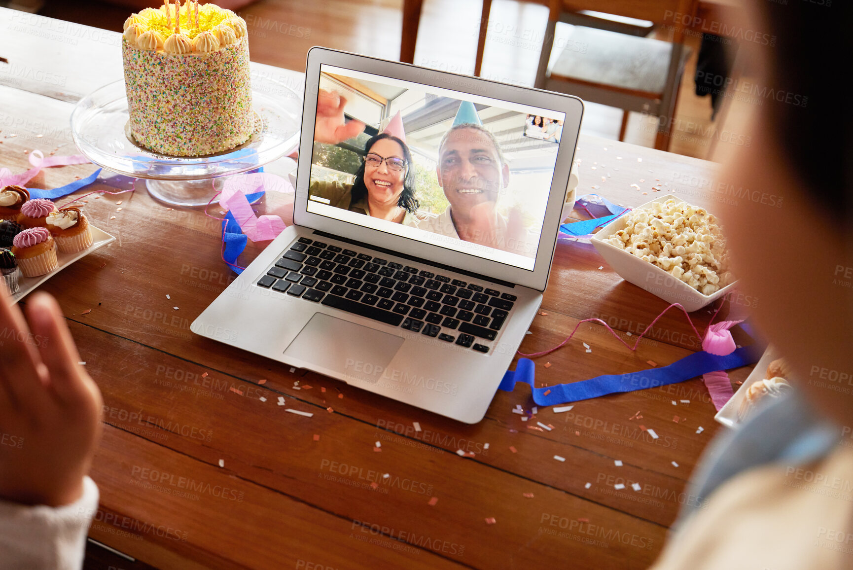Buy stock photo Birthday cake, video call and laptop on table with people online to celebrate on virtual chat. Couple talking to family with internet connection, communication and technology at home for celebration