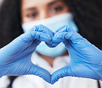 Healthcare, hands and doctor with emoji heart at a hospital for support, hope or thank you for organ or blood donation. Zoom, love and female nurse with finger frame for gratitude in Covid research